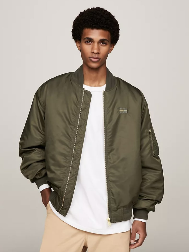 Olive green bomber jacket with a sateen finish and logo on the back