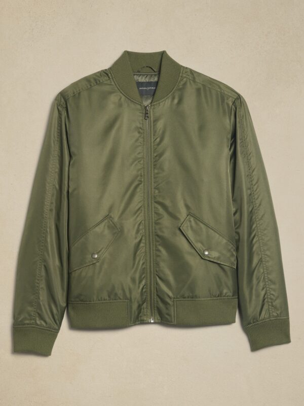 Olive green nylon bomber jacket with ribbed collar, arm cuffs, and hem.